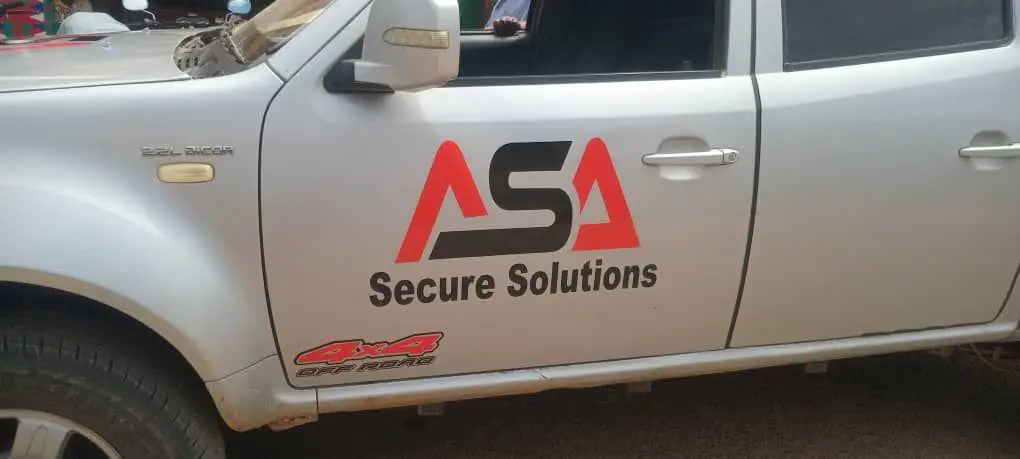 Close view of the ASA Secure Solutions logo on a patrol vehicle door